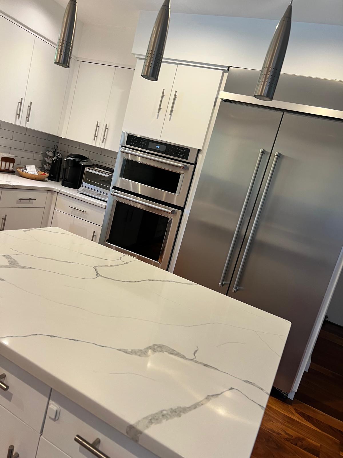 Kitchen island and appliances cleaned by OxyPro Cleaning Services